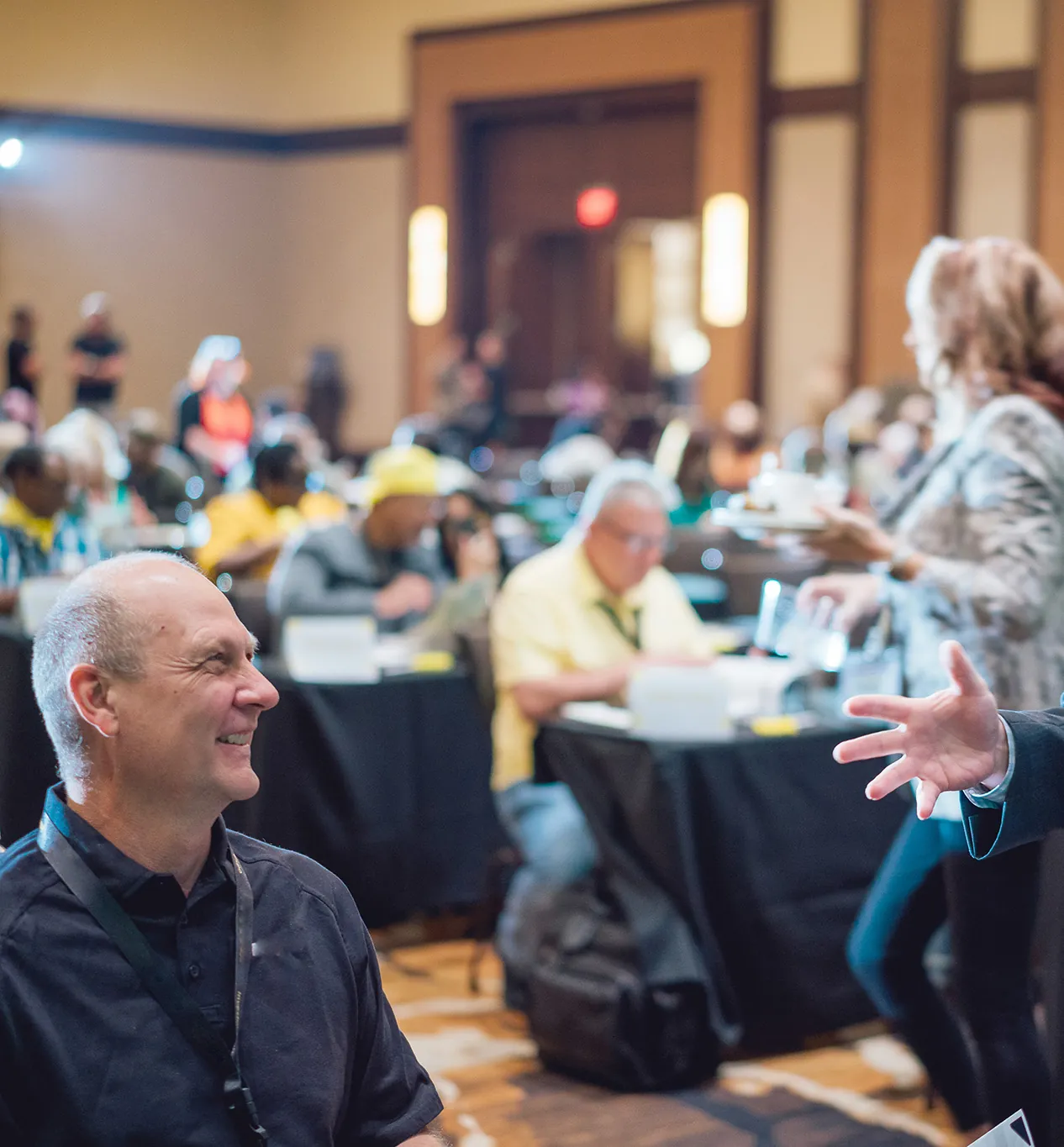 Investors in conversation at a conference session